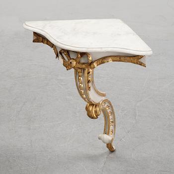 A samll console table for a corner with a wooden top.