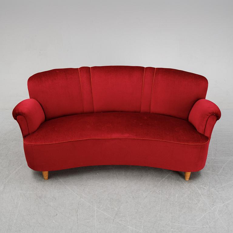 A first half of the 20th Century sofa with velvet upholstery.