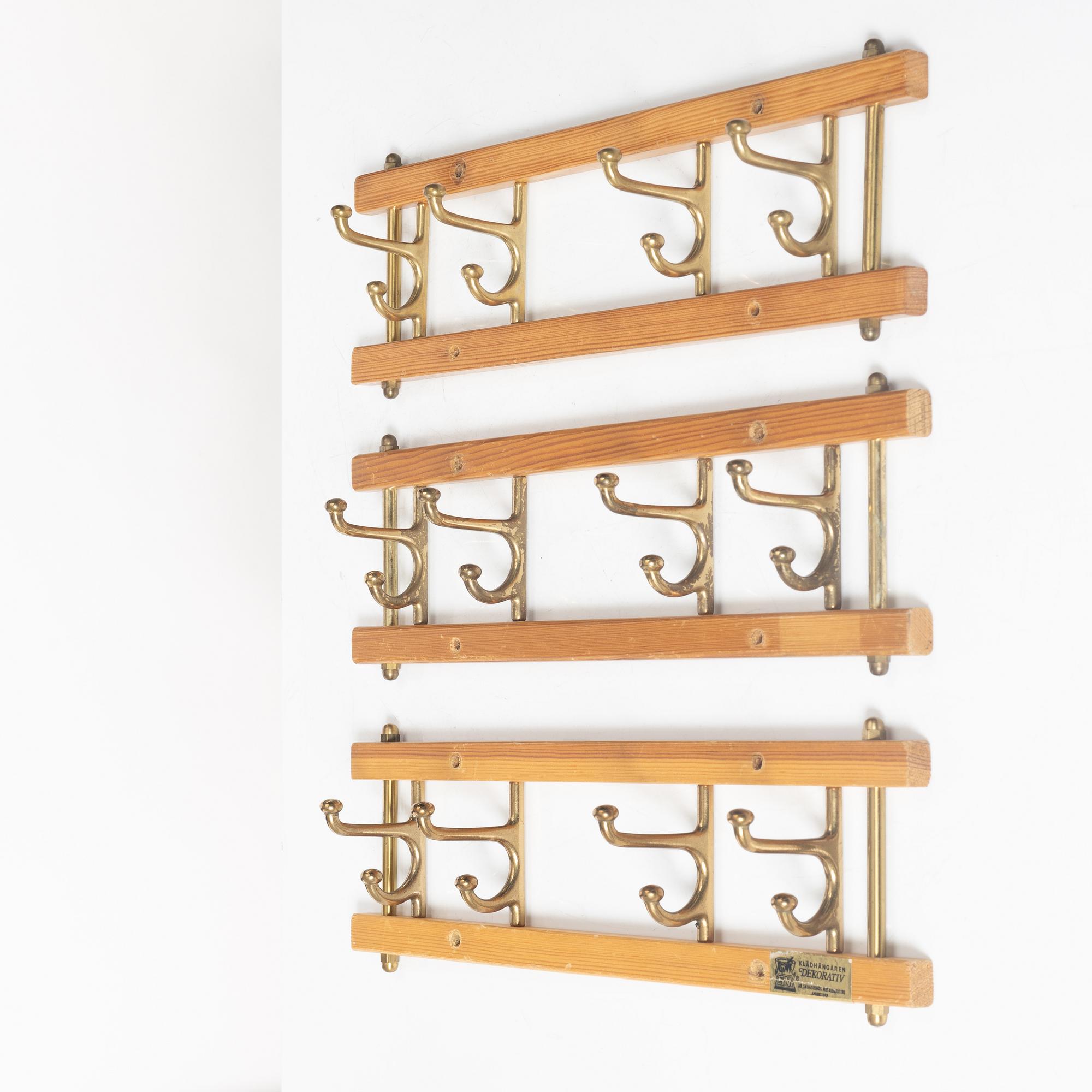 A set of three 'Decorative' coat hangers, Skoglunds metallgjuteri, Anderstorp, 1950s/60s.