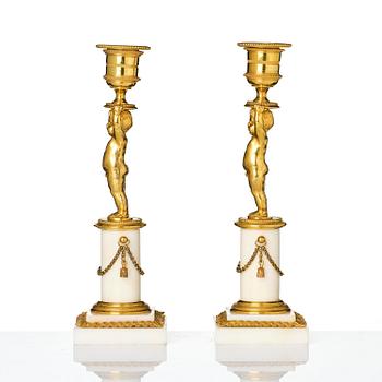 A pair of late Gustavian ormolu and white marble candlesticks, Stockholm, late 18th century.