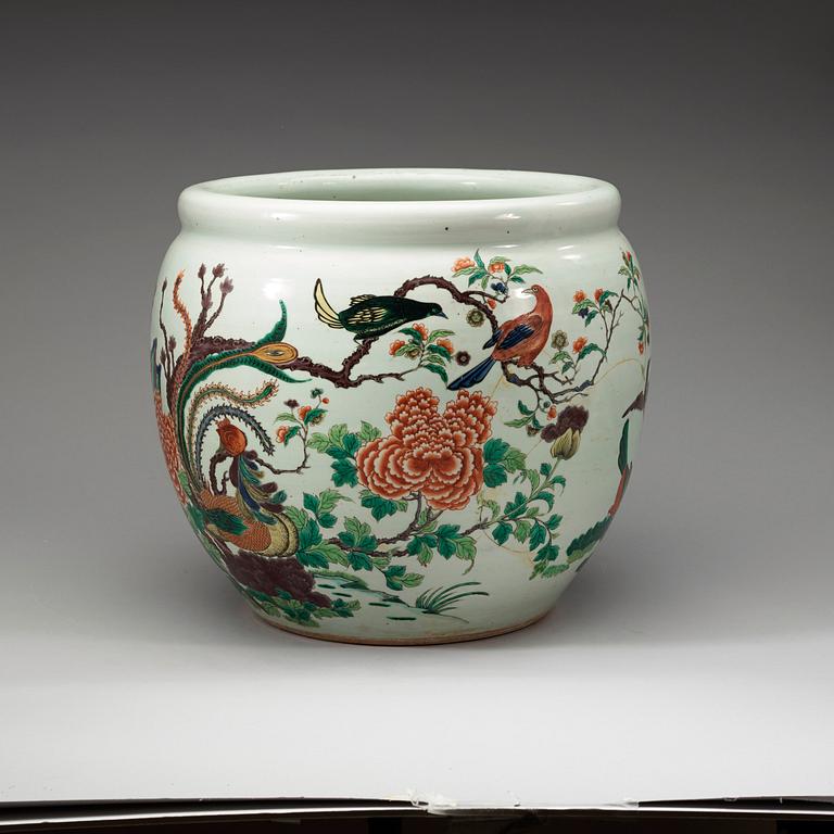A famille rose jardiniere, decorated with a terrace scene with blossom and birds, late Qing dynasty, about 1900.