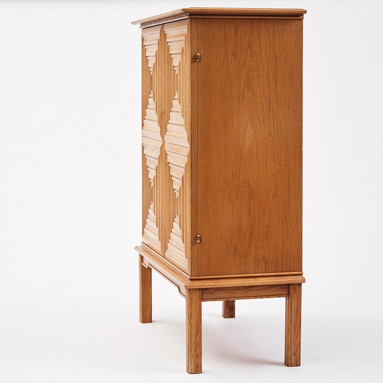 Oscar Nilsson, attributed to, a Swedish Modern oak cabinet, 1940s.