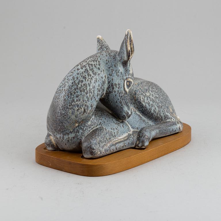 GUNNAR NYLUND, a unique stoneware sculpture of a reclining deer, Rörstrand, Sweden mid 20th Century.