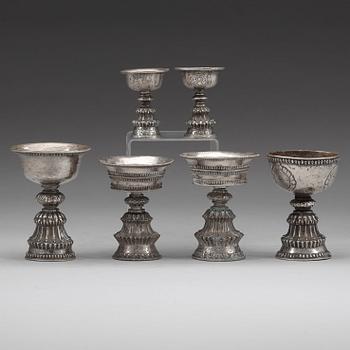 A group of six Tibetan silver/silvered Butter lamps, 19th Century.