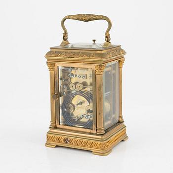 A French Brass and Glass Aiguilles Carriage Clock with Leather Case, first half of the 20th century.