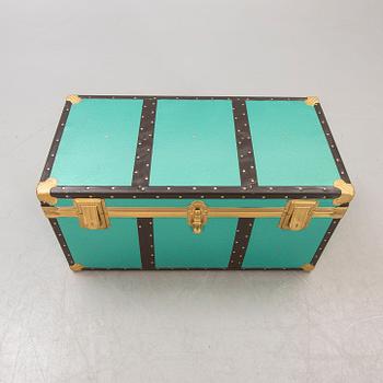 A mid 1900s metal trunk.