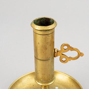 A set of six 19th-century brass candlesticks.