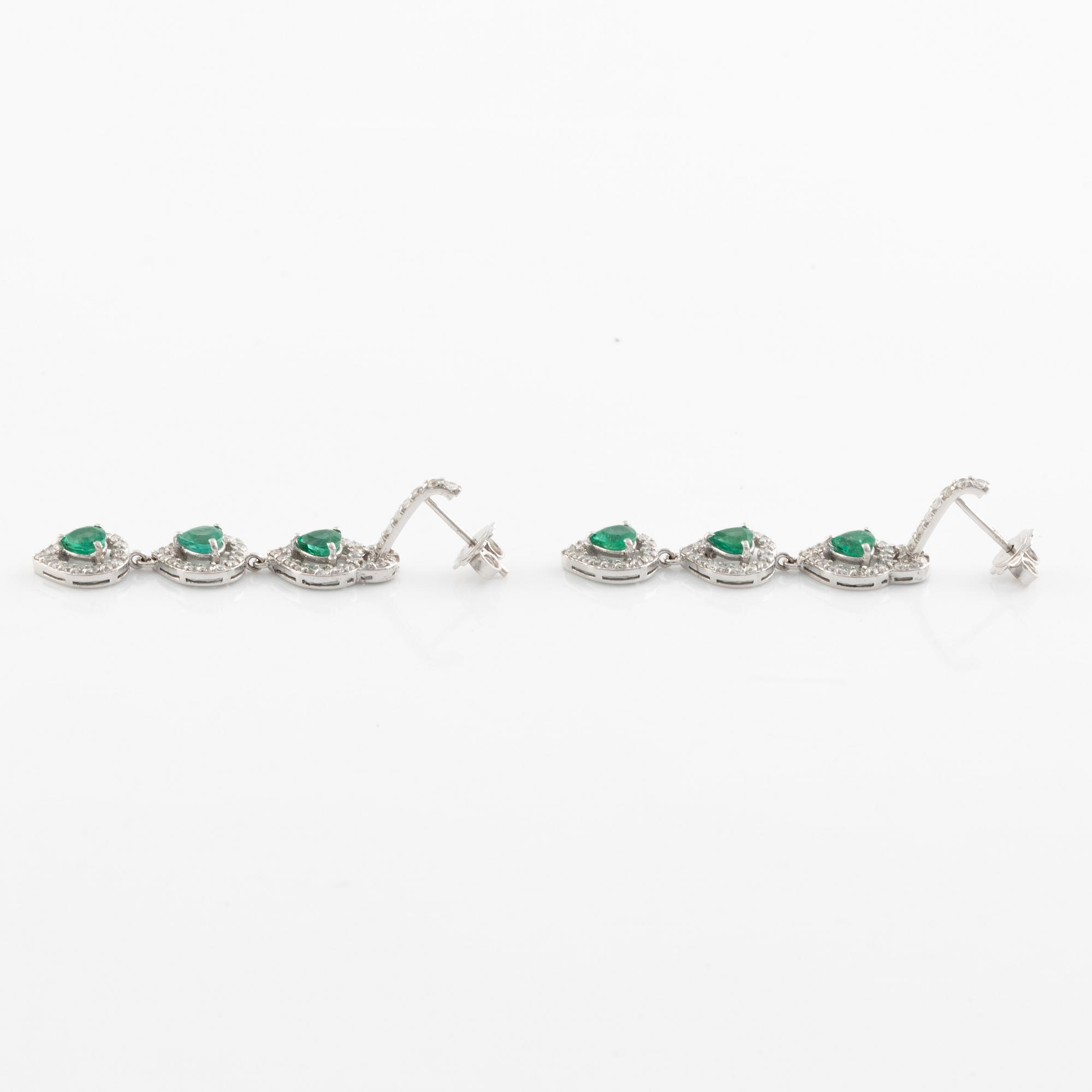 Emerald and brilliant cut diamond earrings.