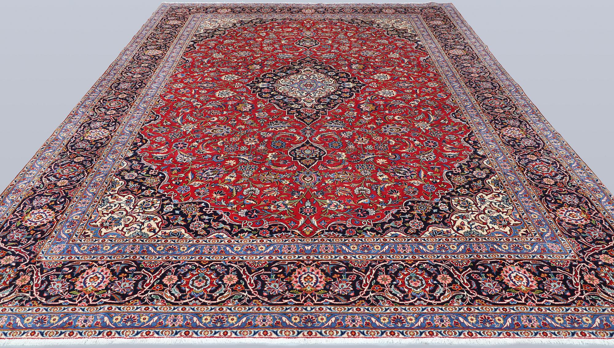 A semi-antique Keshan carpet, approx. 420 x 315 cm.