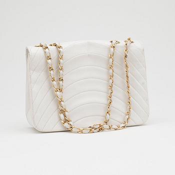 CHANEL, a white leather shoulder bag.