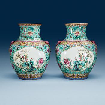 1517. A large pair of turquoise ground famille rose vases, early 20th Century with Qianlongs sealmark.