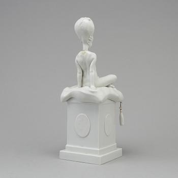 A white glazed Royal Copenhagen porcelain nodding head figure, Denmark, early 20th Century. Not first quality.