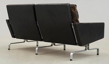 A Poul Kjaerholm 'PK-31-2' steel and black leather sofa,E Kold Christensen, Denmark.
