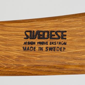 Yngve Ekström, A pair of armchairs, a footstool, “Lamino”, and a side table, Swedese, 2000s.