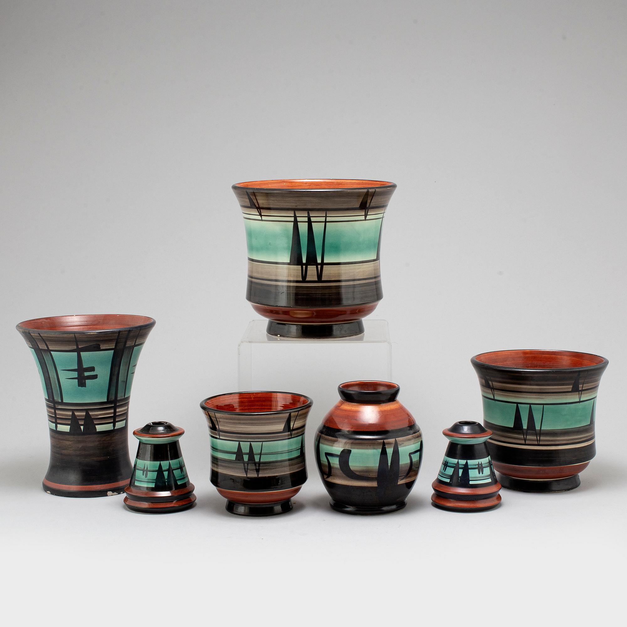 MAGGI WIBOM, a set of 7 faience vases, flower pots, candle holders, Bo Fajans, Sweden, 1920-30s.