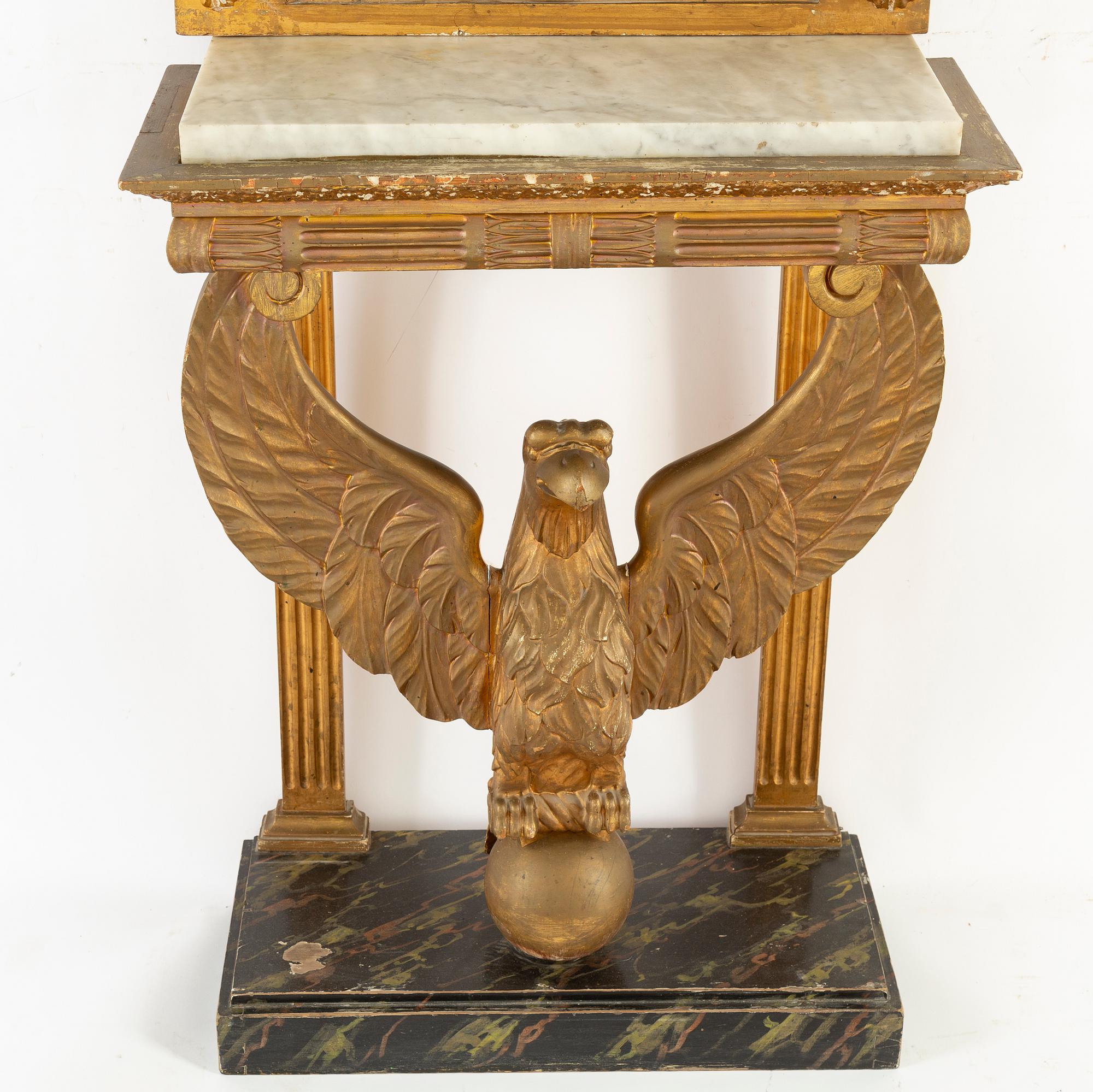 A Swedish Empire Mirror frame and console table, first half of the 19th century.