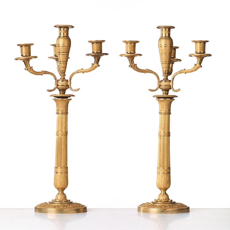 A pair of Empire early 19th century gilt bronze four-light candelabra.