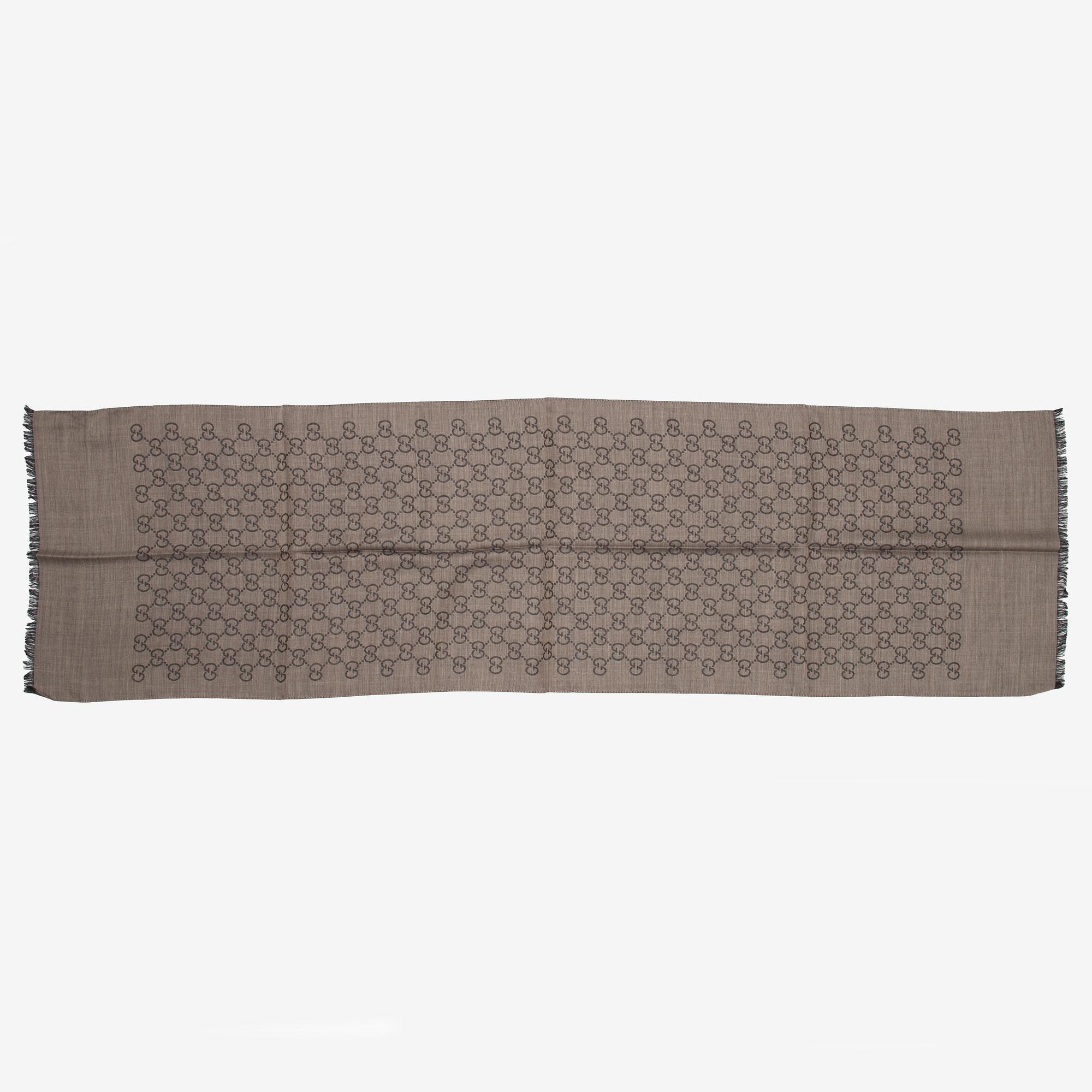 Gucci, a wool and silk mix 'GG' jaquard shawl.