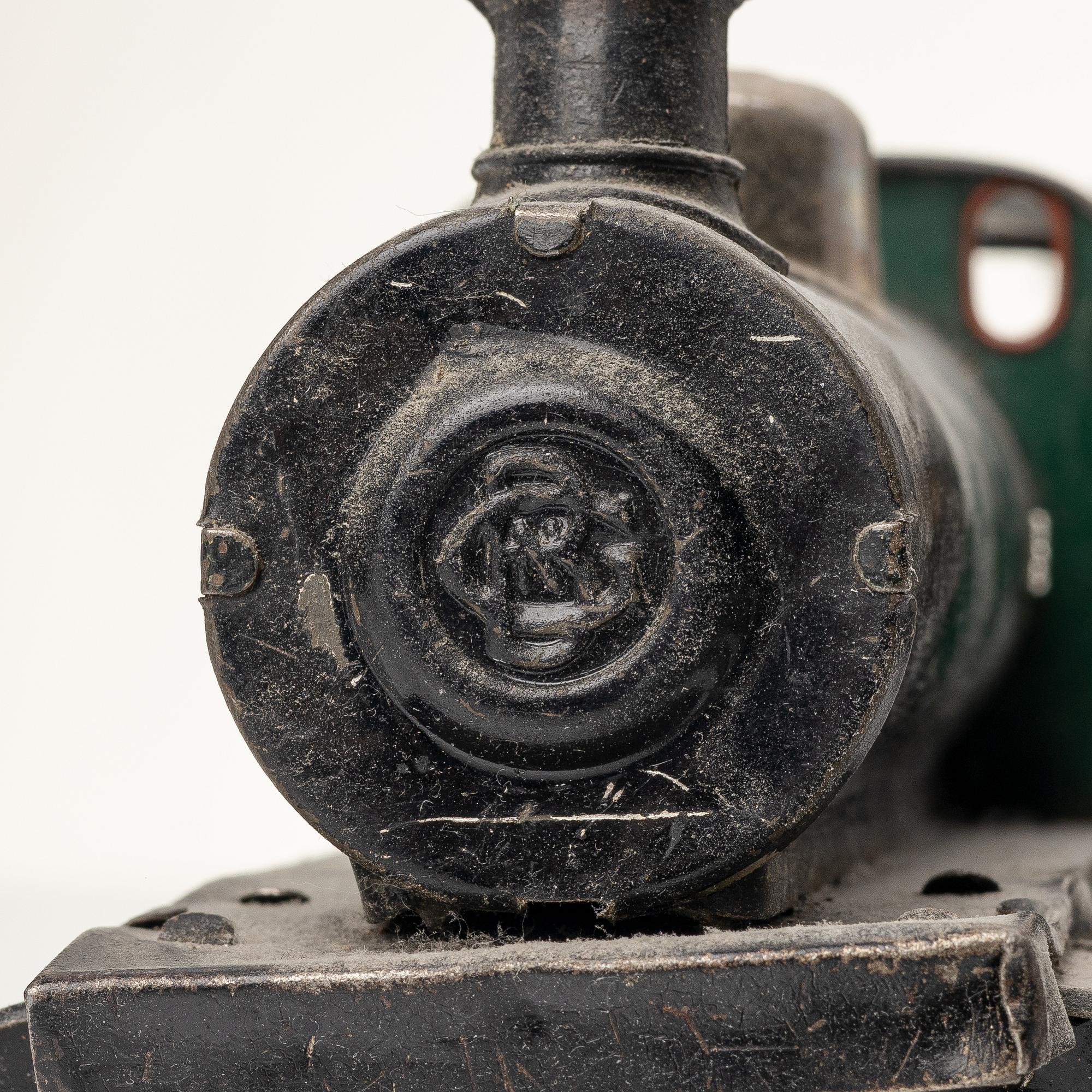 Model train with track and station building, 13 pieces, Germany, 1920s.