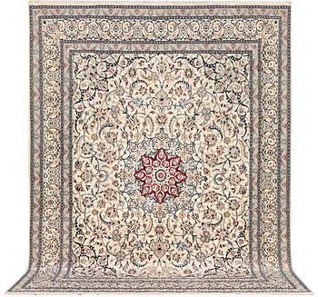 A Nain carpet, part silk, 9 laa, c. 390 x 295 cm.