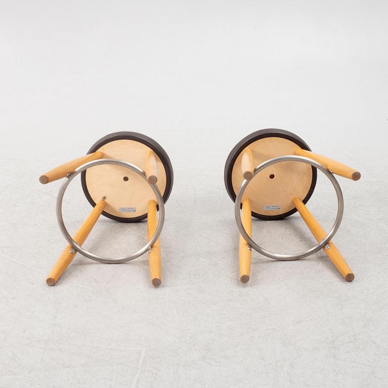 Hans J. Wegner, a pair of bar stools, CH 58, Carl Hansen & Son, Denmark, 21st century.