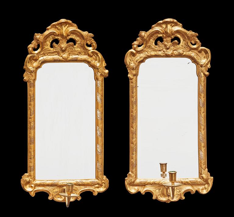 A pair of Swedish Rococo 18th century one-light mirror girandoles.