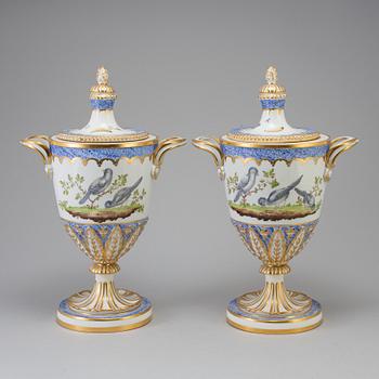 A pair of French 19th century porcelaine 
lidded vases with Sèvres style mark.
