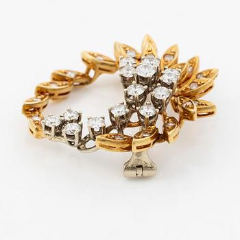 Brosch 18K guld med runda briljantslipade diamanter.