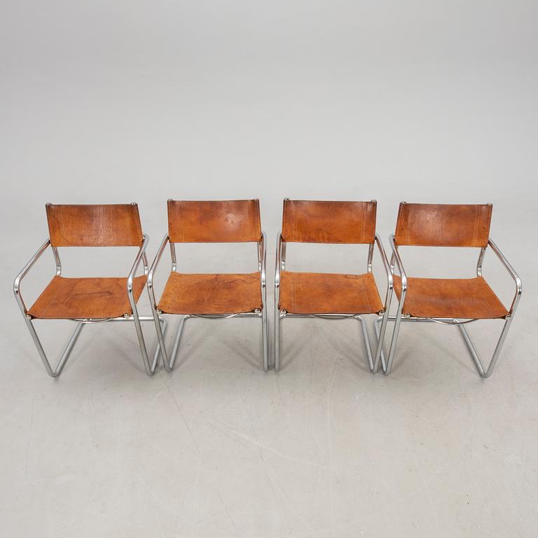 A set of four Italian late 20th century chrome and leather armchairs.