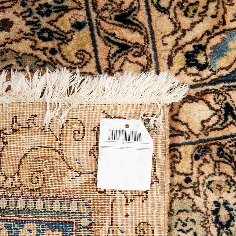 An antique Tabriz carpet, North West Persia, signed Akhondzadeh, c. 394 x 295 cm.