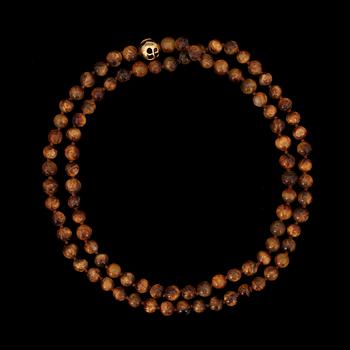 A Tiffany & Co Angela Cummings necklace with tigers eye quartz and gold clasp.