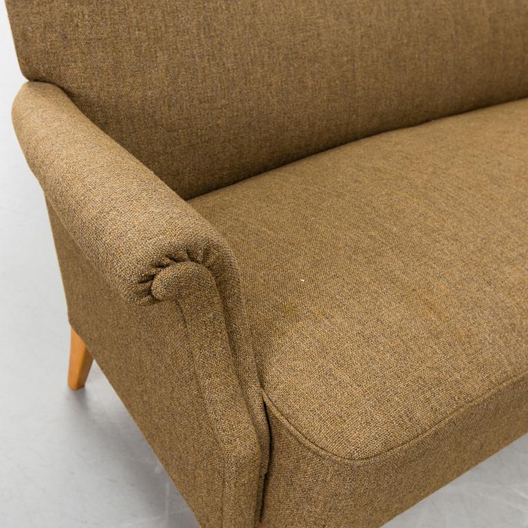 A 1940s  Dux sofa.