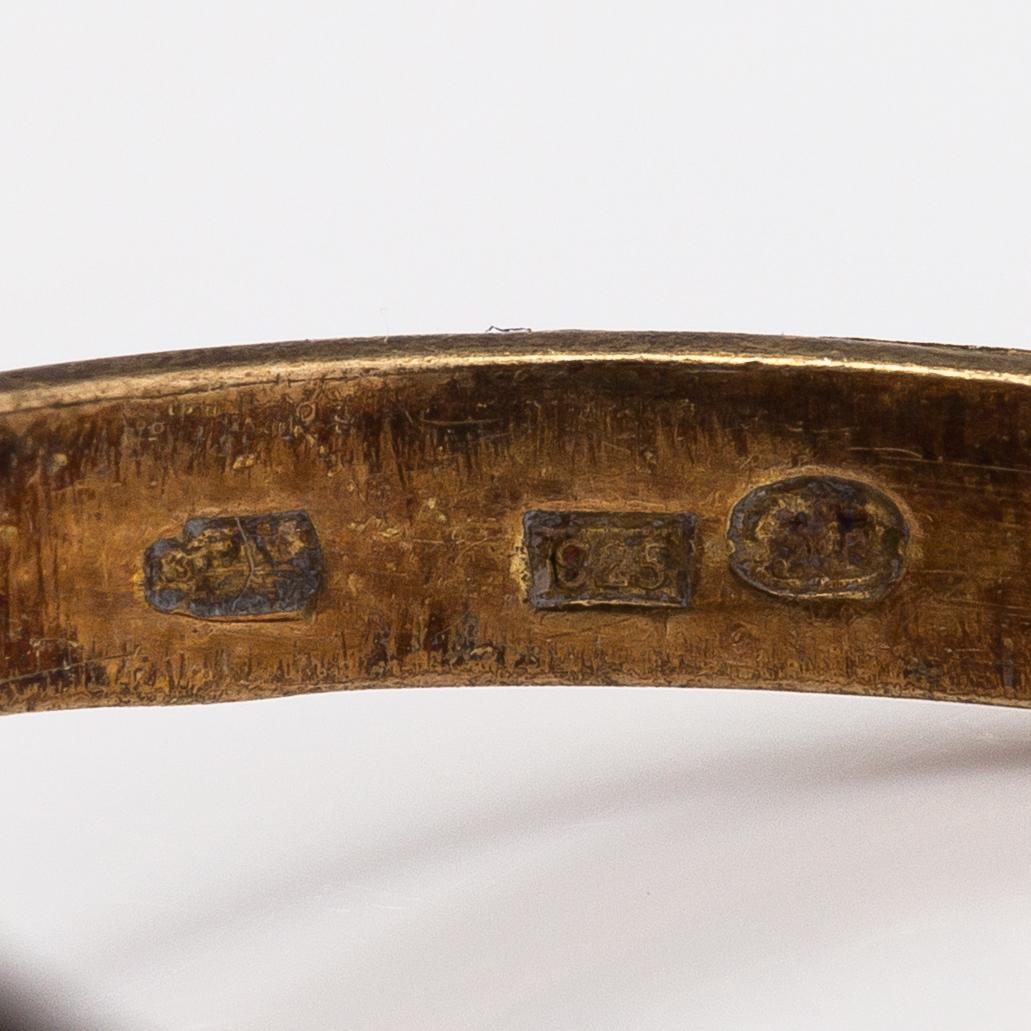 Sormus, korvakorupari ja kaulakoru, kullattua hopeaa ja granaatteja.