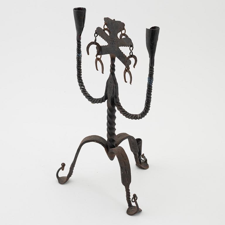 A Seedish wrought-iron three-light candlestick, circa 1900.