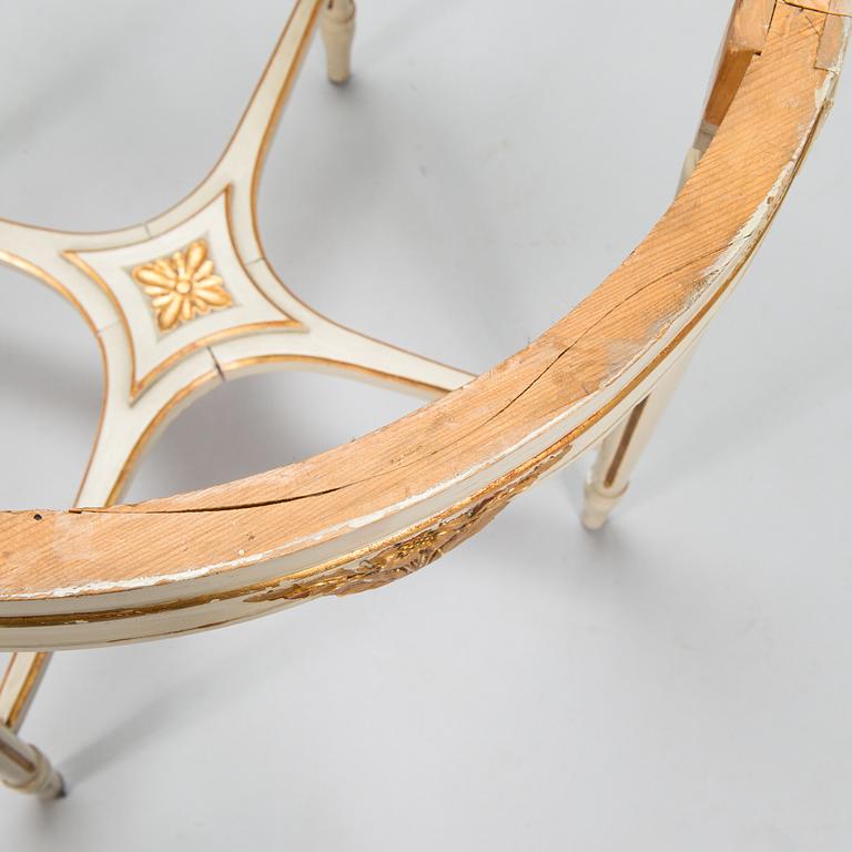 A Gustavian style sofa and table from early 20th century.