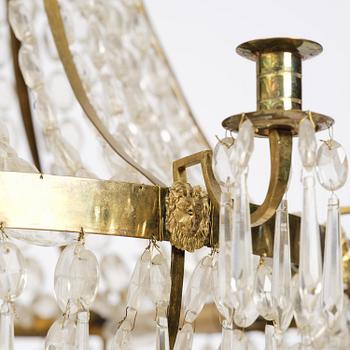 A Swedish gilt brass and cut glass thirteen-light Empire chandelier, early 19th century.