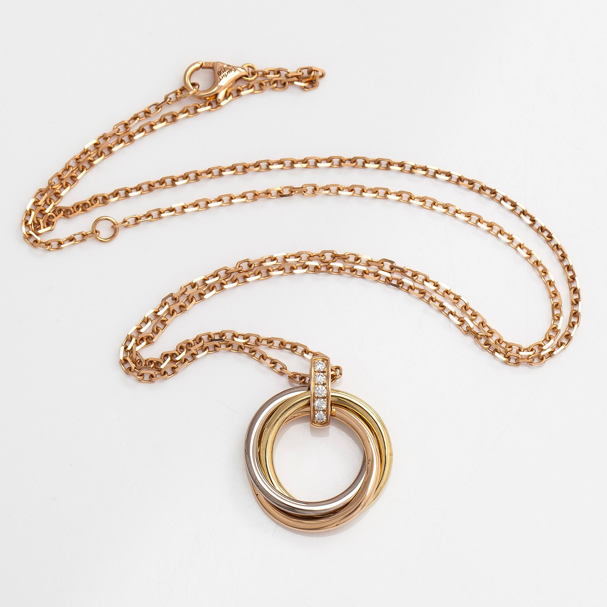 Cartier, an 18K gold 'Trinity Pendant' necklace with brilliant-cut diamonds.