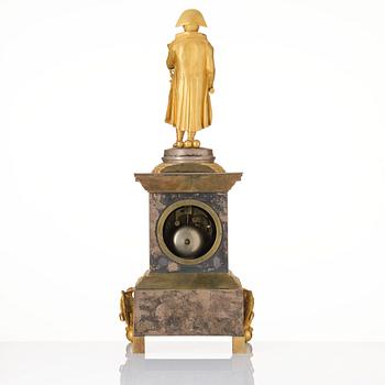 A French Empire ormolu and silvered bronze figural mantel clock, first part of the 19th century.