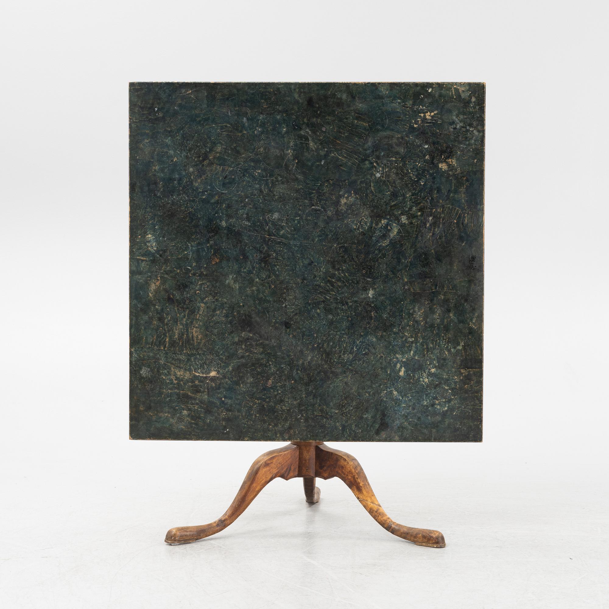 A root veneered tilt-top table, 19th Century.