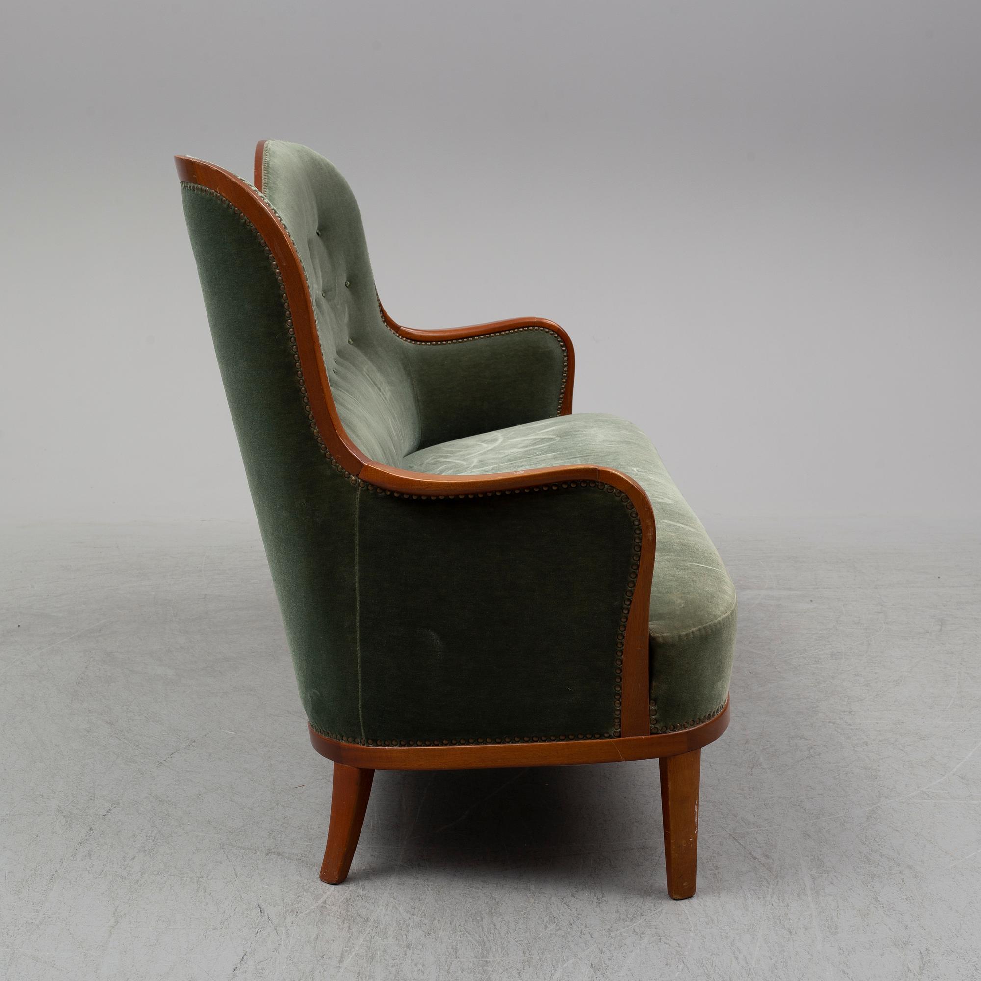 CARL MALMSTEN, an 'Advokaten' mahogany sofa.