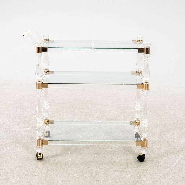 A 1970s plexi and brass serving trolley.