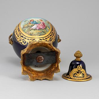 A French porcelain and gilt bronze urn with cover, 20th century.