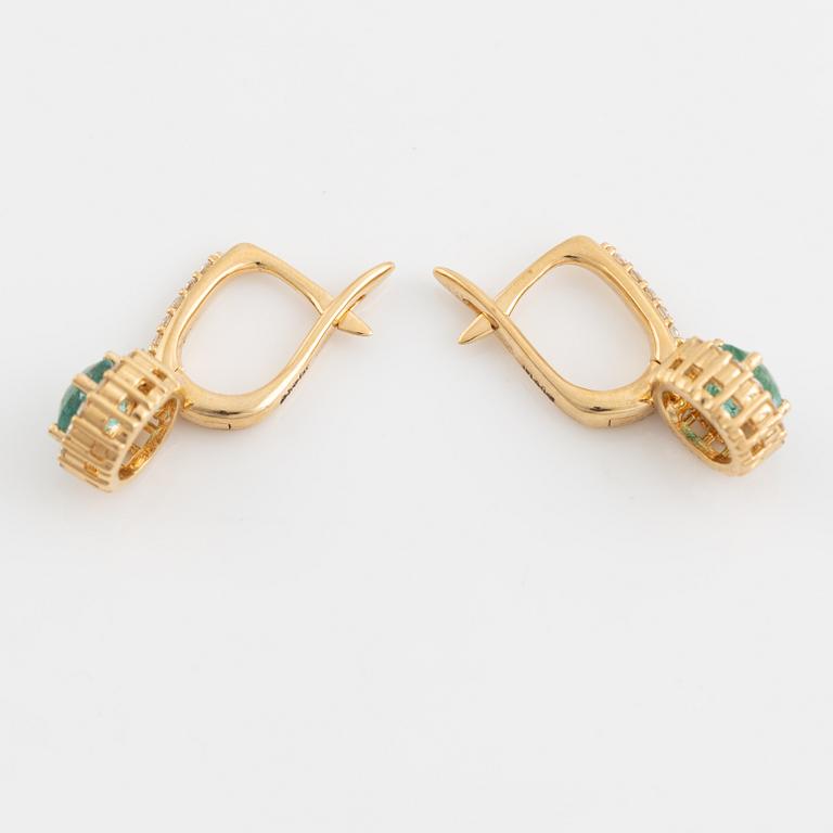 Emerald and brilliant cut diamond earrings.