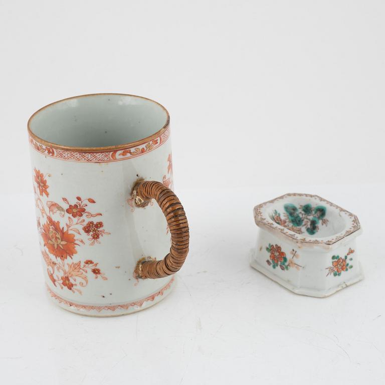 A rouge de fer mug and a famille rose salt, Qing dynasty, 18th Century.