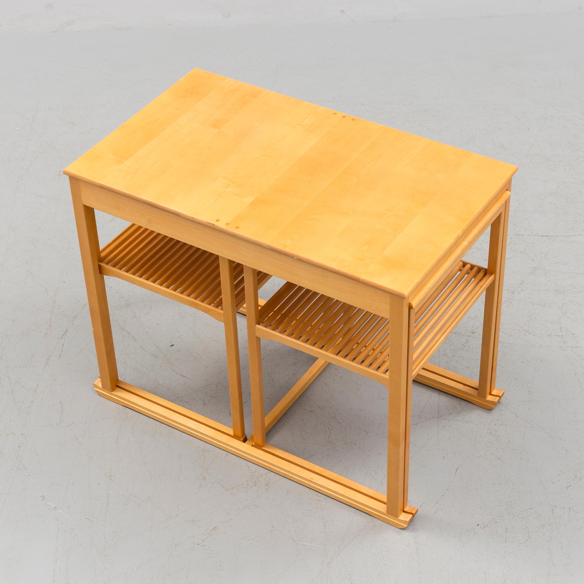 A Swedish Carl Malmsten "The Sled" birch side table nesting table i three parts, Åfors Möbelfabrik.