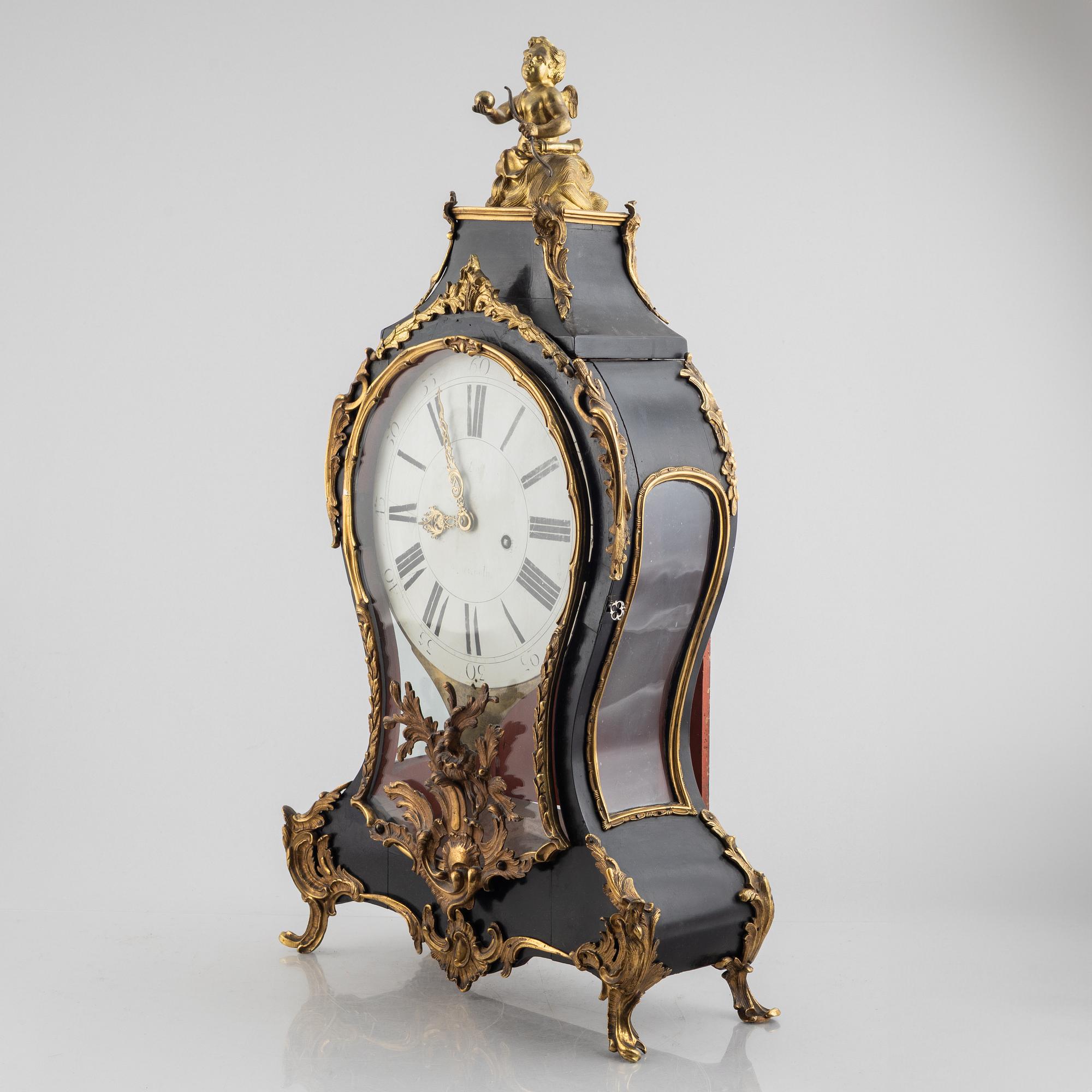 Clock, Rococo style with partially older parts, around the year 1900.