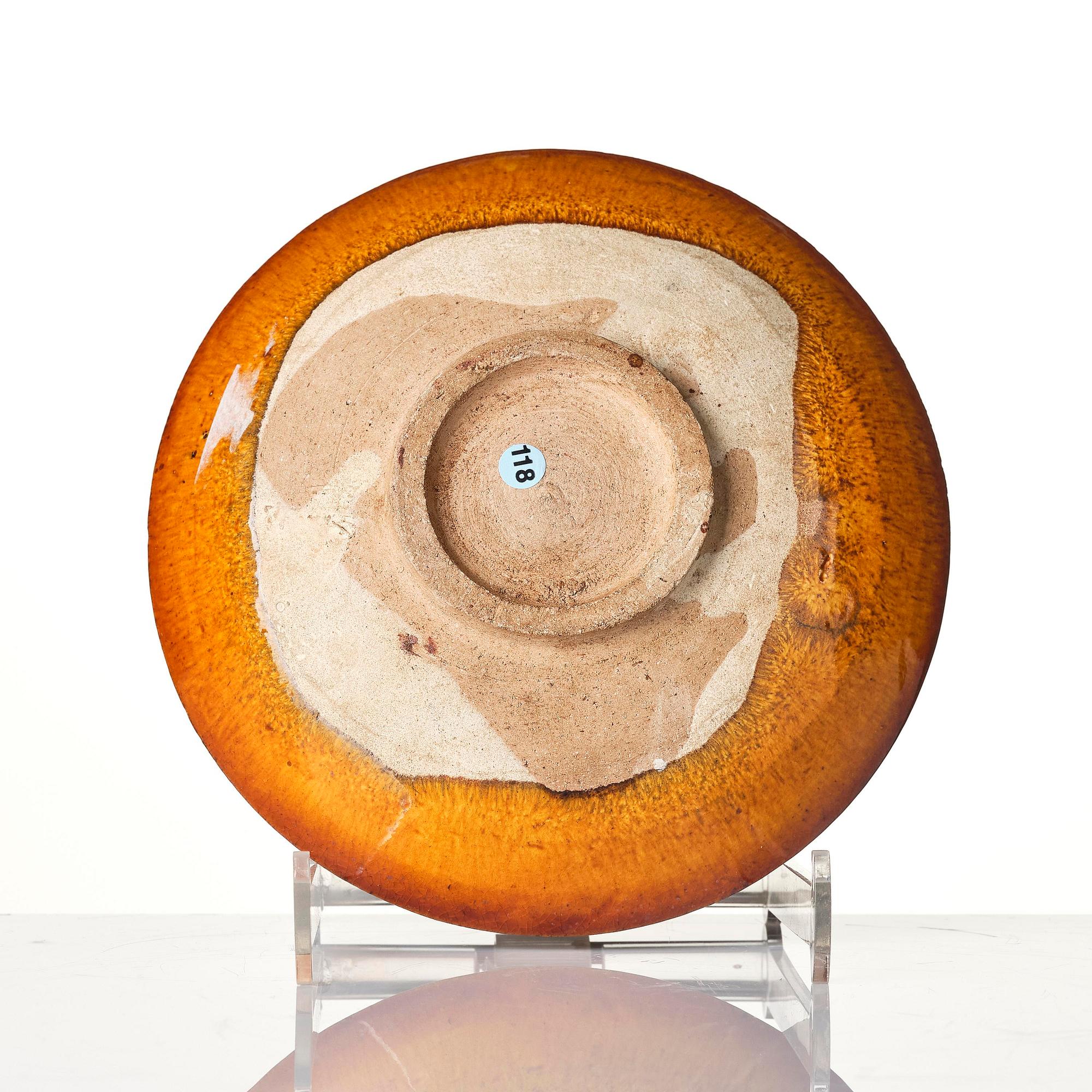 A yellow glazed dish, Liao dynasty (907–1125).