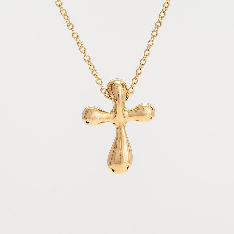 Tiffany & Co, Elsa Peretti, an 18K gold cross pendant necklace.