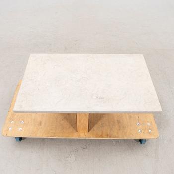 A 21st century limestone coffee table.