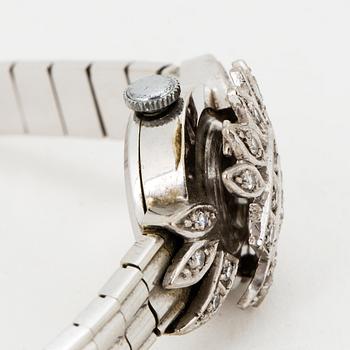 A ladies diamond watch.